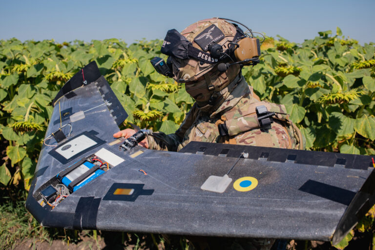Ukrainian soldier prepares to launch a drone. Source: https://war.ukraine.ua/imagebank/