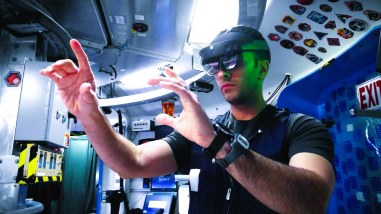 A research volunteer uses augmented reality goggles to perform astronaut-like tasks during a simulated space mission. Participants selected for NASA’s first Moon and Mars Exploration Analog mission also will perform tasks in immersive, interactive environments while living inside habitats that simulate traveling to and living on the Moon and Mars. Credit: NASA