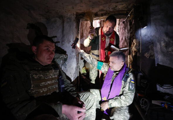 A religious service underway inside a Ukrainian bunker near the front line.