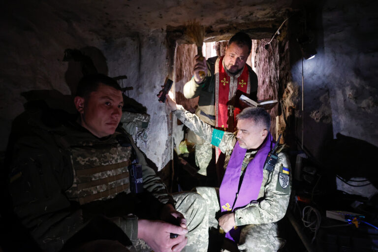 A religious service underway inside a Ukrainian bunker near the front line.