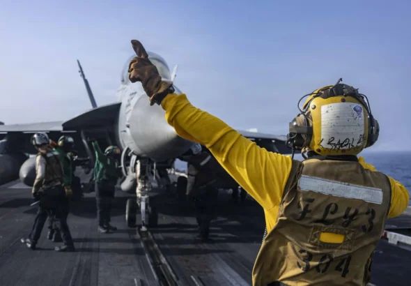 A fighter jet prepares to launch from the flight deck of USS Abraham Lincoln on June 25. Source: US Navy