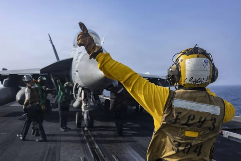 A fighter jet prepares to launch from the flight deck of USS Abraham Lincoln on June 25. Source: US Navy