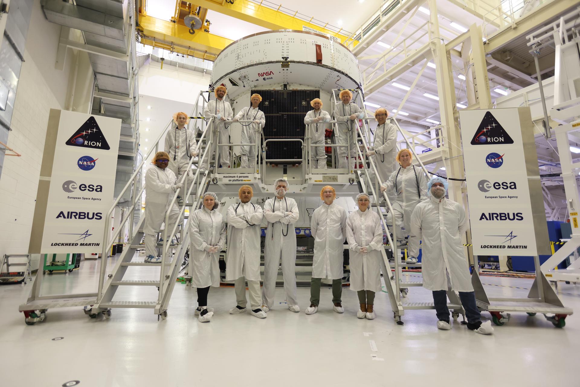 IOZ ESM Team Photos: Solar array wings for the agency’s Artemis III Orion spacecraft. NASA and its partners work on the on Thursday, April 30, 2026, inside the Neil A. Armstrong Operations and Checkout Building at NASA’s Kennedy Space Center in Florida. Orion’s solar arrays, manufactured and installed by ESA (European Space Agency) and its contractor Airbus, have been temporarily installed ahead of acoustic testing on the spacecraft. .   Image Credit: NASA/Ben Smegelsky Source: https://www.nasa.gov/image-detail/amf-ksc-20260430-ph-jbs01_0004/
