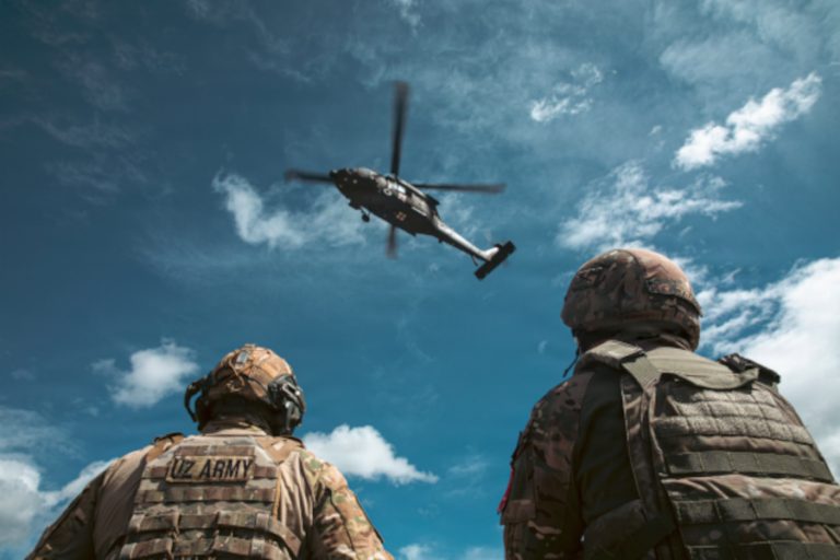 Regional Cooperation 2026: Uzbek and Kyrgyz Republic partners observe a UH-60 Black Hawk during medical evacuation training as part of Exercise Regional Cooperation 26 at Fort Harrison, Montana, June 9, 2026. Regional Cooperation 2026 is an annual, multinational U.S. Central Command-sponsored command-post, field training and cyber defense exercise conducted by U.S. National Guard units in partnership with nations from Central and South Asia, and other participating nations. (Oklahoma National Guard photo by Sgt. Anthony Ackah-Mensah)