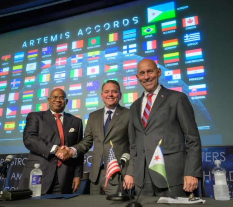 NASA Deputy Administrator Matt Anderson, center, Ambassador of Djibouti to the United States, Mohamed Siad Douale, left, and Assistant Secretary of State for African Affairs, Frank Garcia, right, pose for a group photograph after the Artemis Accord signing, Monday, September 14, 2026, at the Mary W. Jackson NASA Headquarters building in Washington. NASA/Bill Ingalls.