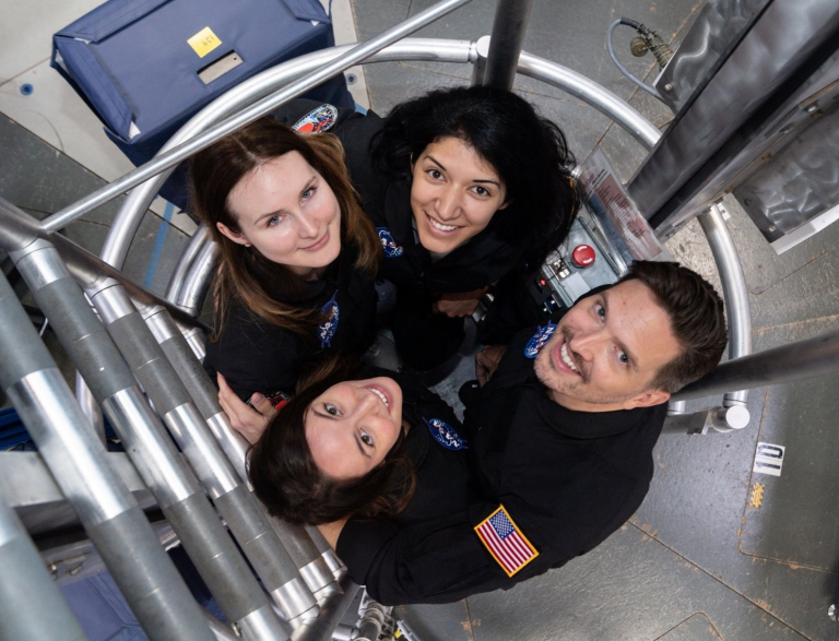 A crew inside NASA’s Human Exploration Research Analog looks up from the habitat’s ladder well for a team photo. Credit: NASA. Source: https://www.nasa.gov/hrp/