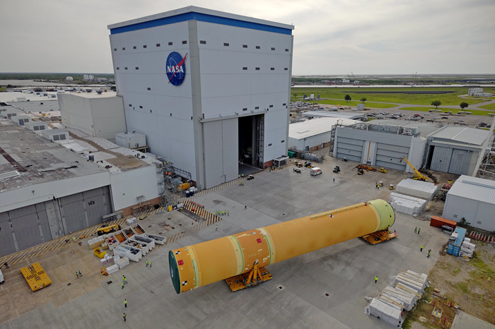 NASA moved the core stage, or the largest section, of the SLS (Space Launch System) rocket that will launch the crewed Artemis III mission in 2027 from the agency’s Michoud Assembly Facility to the agency’s Pegasus barge in New Orleans on April 20. Credit: NASA/Michael DeMocker. Source: https://www.nasa.gov/news-release/nasa-rolls-out-artemis-iii-moon-rocket-core-stage/
