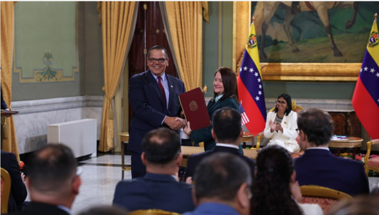 Photo: Mariano Vela (left), the president of Chevron Venezuela, recently met with Venezuela’s Minister of Petroleum and Hydrocarbons Paula Henao (standing, right) in Caracas. Source: https://www.chevron.com/newsroom/2026/q3/a-turning-point-for-energy-in-venezuela
